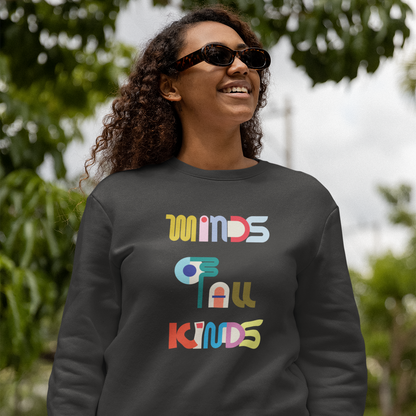 Person wearing a dark gray sweatshirt with colorful text outdoors