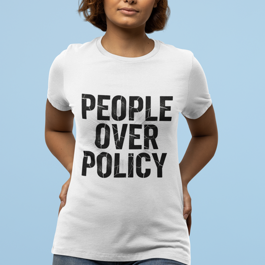 Person wearing a white t-shirt with 'People Over Policy' text on a light blue background